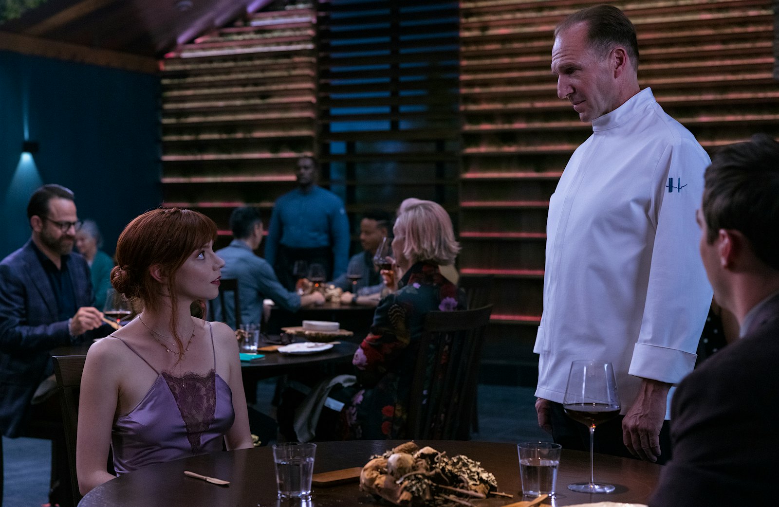 In the film The Menu, a couple played by Anya Taylor-Joy and Nicholas Hoult travels to a coastal island to eat at an exclusive restaurant where the chef, played by Ralph Fiennes, has prepared a lavish menu with some shocking surprises.